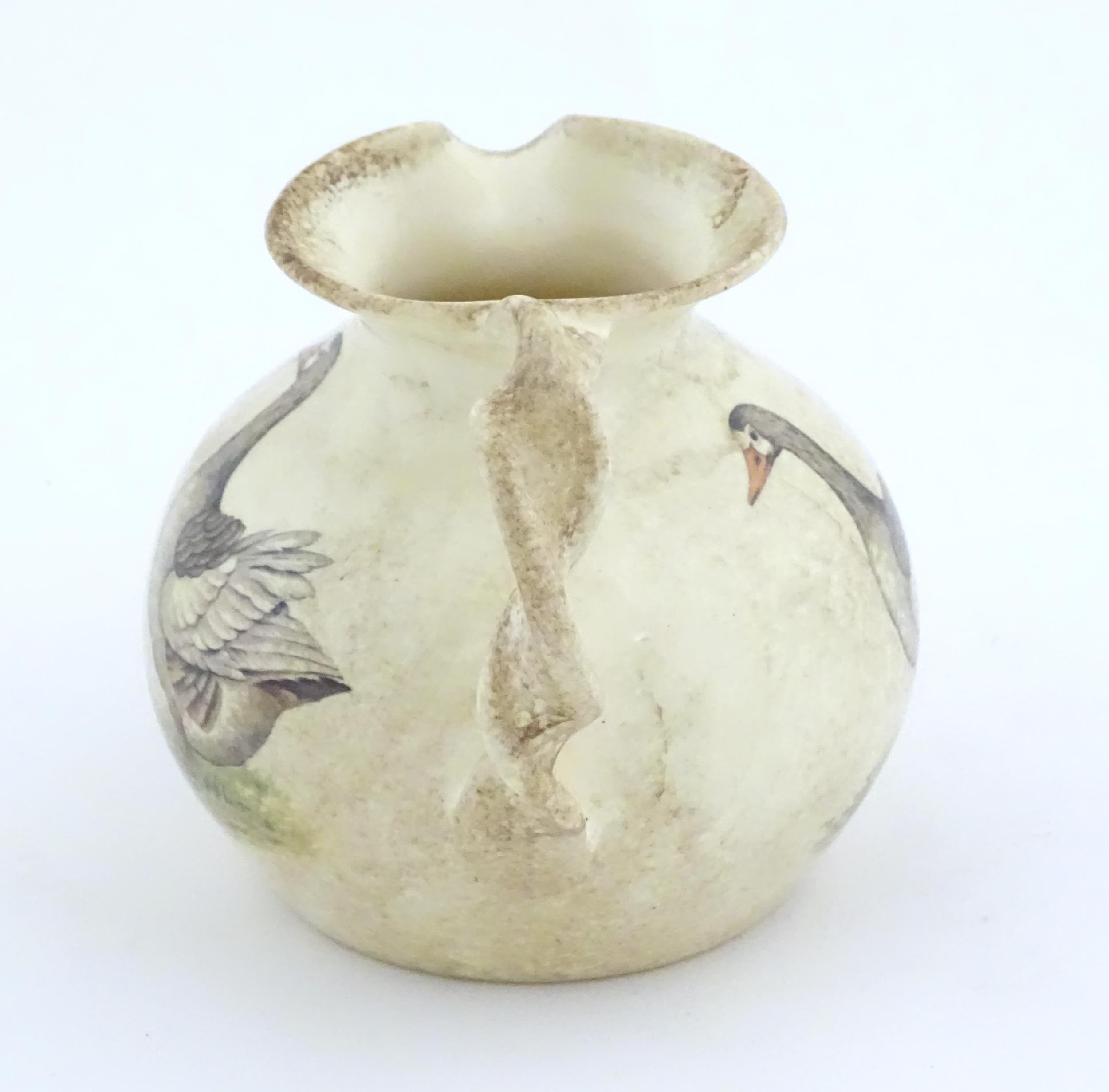 A Yorkshire Moorlands pottery jug with twist handle decorated with geese. Marked under. Approx. 4 - Image 2 of 8
