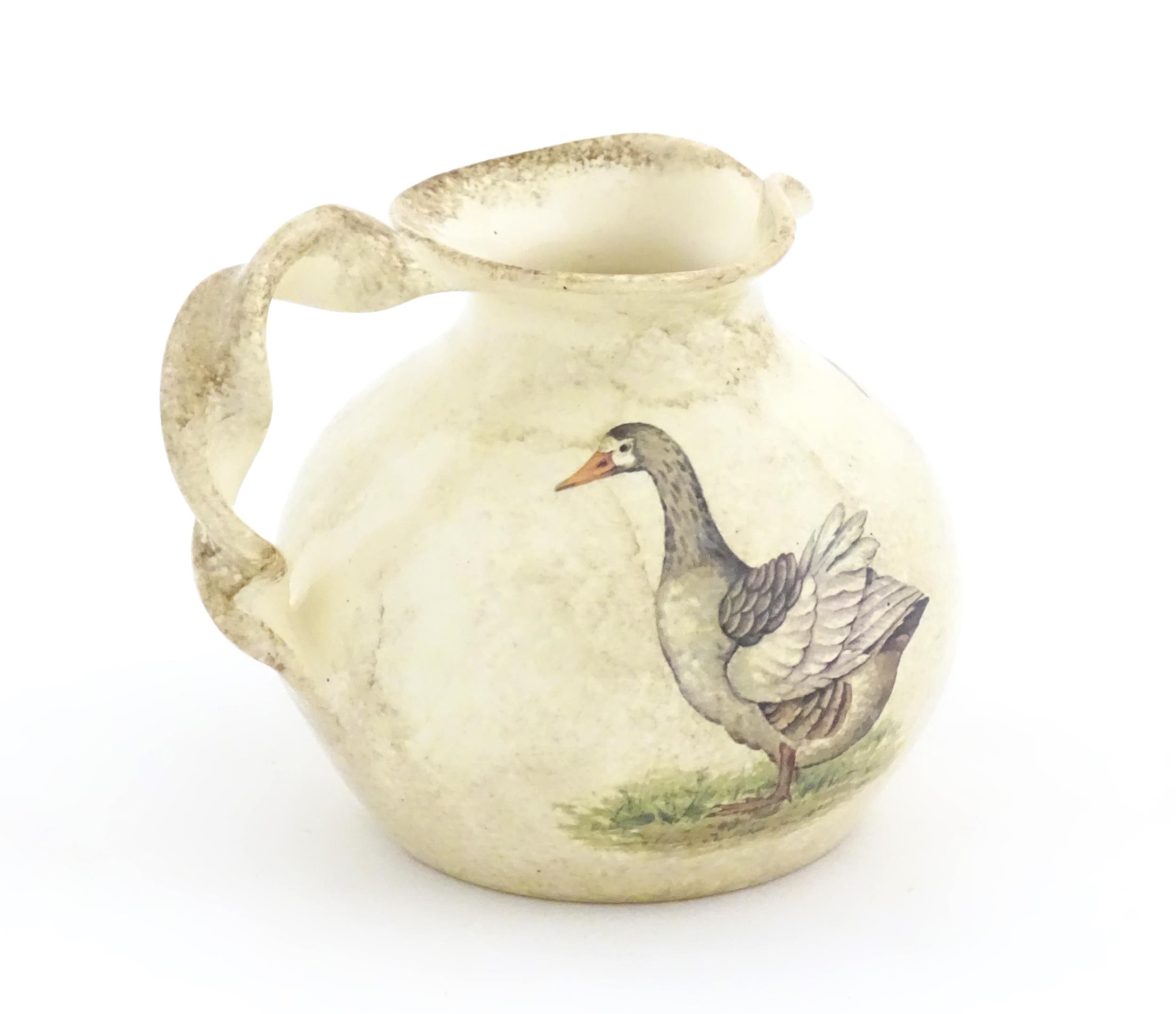 A Yorkshire Moorlands pottery jug with twist handle decorated with geese. Marked under. Approx. 4 - Image 5 of 8