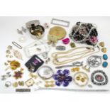 A quantity of assorted costume jewellery to include brooches, beads, cufflinks, etc. Together with a