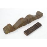 Two carved wooden items one appearing to be a scrolled pediment together with a carved section