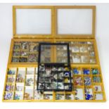 A large quantity of assorted costume jewellery to include earrings necklaces etc in display cases