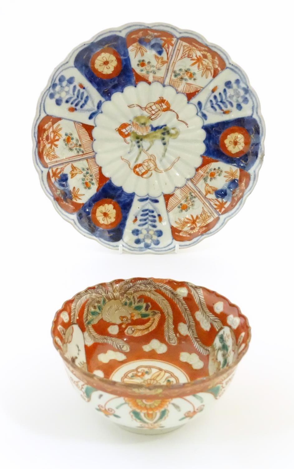 An Oriental plate in the Imari palette decorated with big cat / leopard / cheetah to centre and a