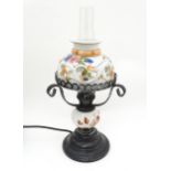 An electric table lamp formed as an oil lamp. Approx 15" high (inc. chimney) Please Note - we do not