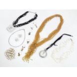 A quantity of assorted costume jewellery to include various beads etc. Together with a silver