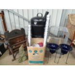 A quantity of miscellaneous garden items, including garden lights with stands, a cast iron fire