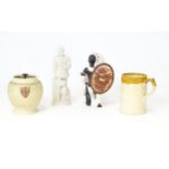 Three ceramic items comprising a two tone tankard with relief detail, tobacco jar, and a Native