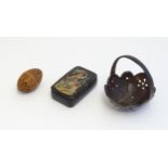 Three assorted items comprising a coconut shell basket with pierced decoration, a carved coquilla