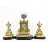 A Continental 19thC ormolu and porcelain clock garniture with Sevres style hand painted porcelain