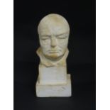 A 20thC plaster cast bust of Winston S. Churchill, on a squared plinth. Signed Clare Sheridan