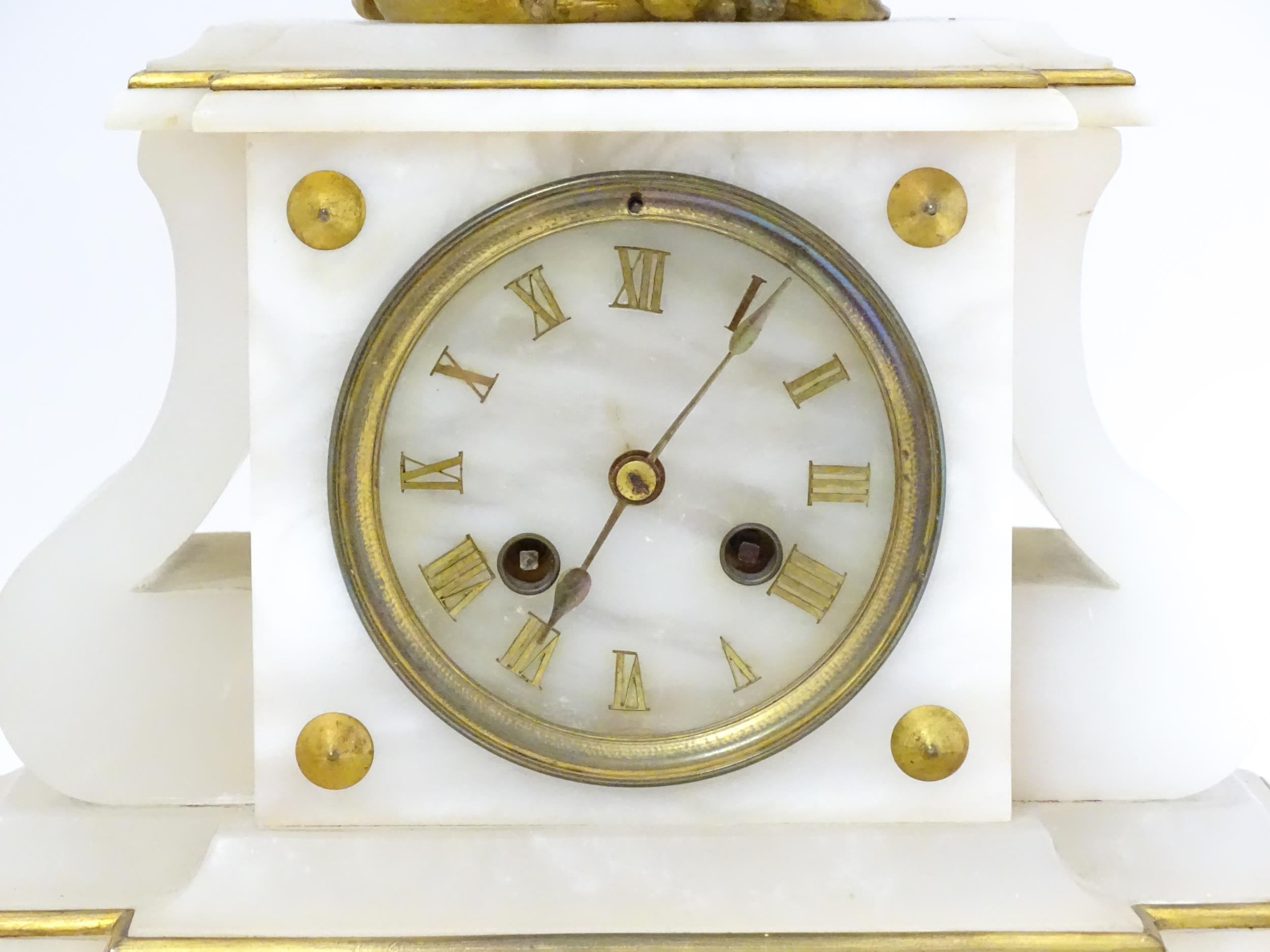 A French Japy Freres mantle clock, the alabaster base with gilt Roman Numerals, surmounted by a cast - Image 6 of 9