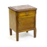 A late 19thC marble topped cabinet, with a rouge marble top above a small drawer and panelled