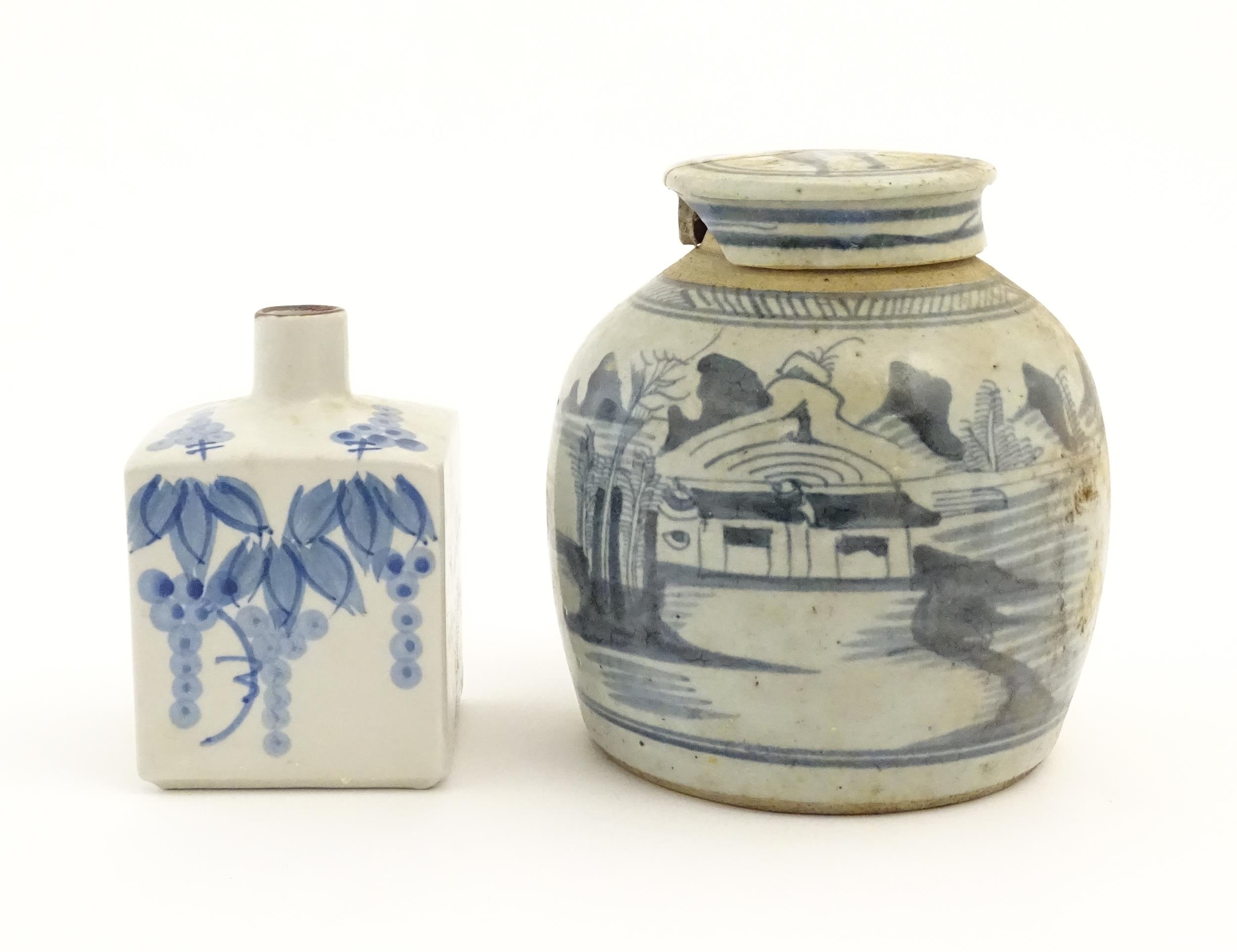 A Chinese blue and white ginger jar and cover with brushwork landscape decoration. Together with a