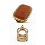 A 19thC gilt metal fob / hand seal set with carnelian with engraved armorial. Approx 1 1/4" high,