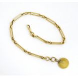 An 18ct gold watch chain approx 17" long. Together with a Geo III spade guinea coin formed fob (