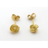 A pair of 9ct gold stud earrings with Russian knot style decoration. Approx. 1/8" wide Please Note -
