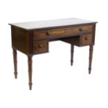 An early 19thC mahogany desk with a reeded edge above a single long drawer and two short drawers and