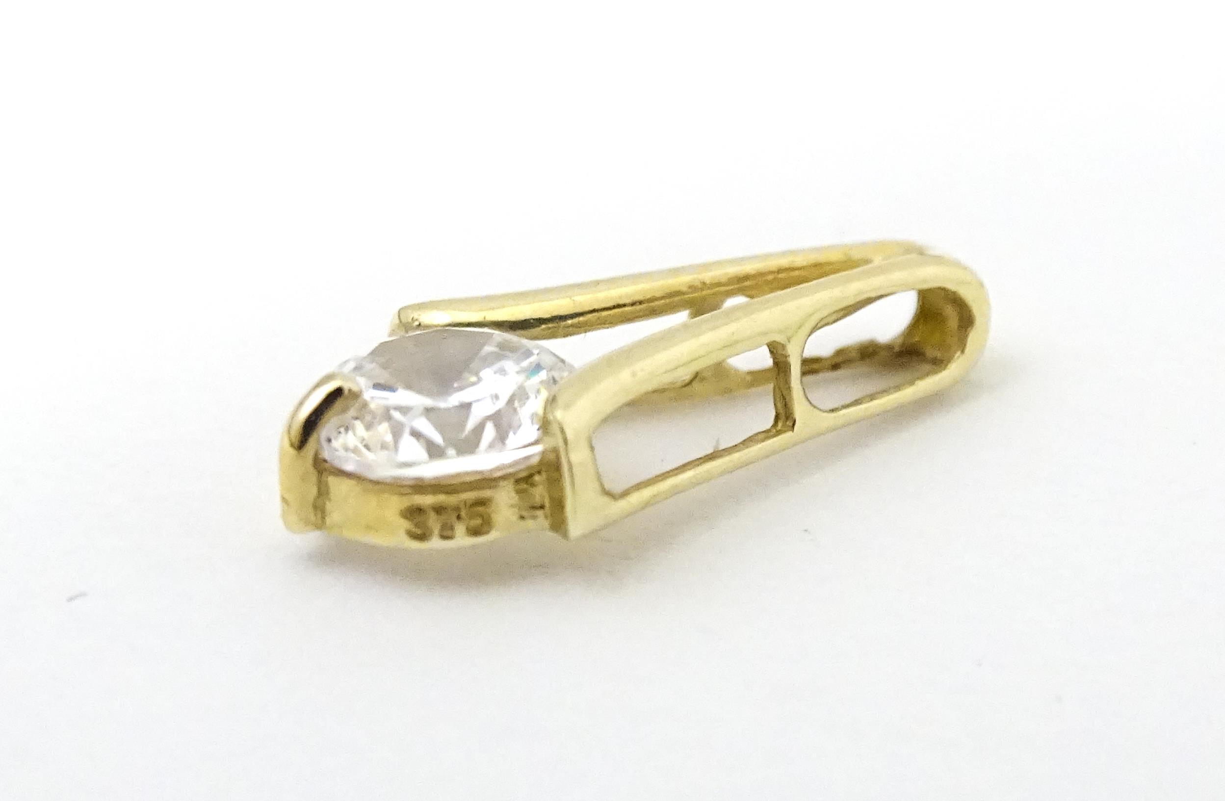 Three 9ct gold pendants set with cubic zirconia. To include a white gold example. Approx 1/2" - Image 6 of 7
