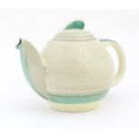 An Art Deco Susie Cooper Kestrel teapot. Marked under. Approx. 4 3/4" high Please Note - we do not