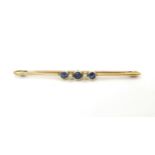 A 15ct gold brooch set with blue stones and pearls . 2 1/2" wide Please Note - we do not make