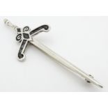 A silver brooch / kit pin of stylised sword form by Malcolm Grey. Marked silver MG Approx. 2 3/4"