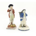 Two 19thC figures comprising a Staffordshire Seasons figure modelled as Autumn, standing with grapes