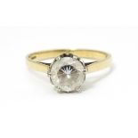 A 9ct gold solitaire ring set with white stone. Ring size approx. K 1/2 Please Note - we do not make