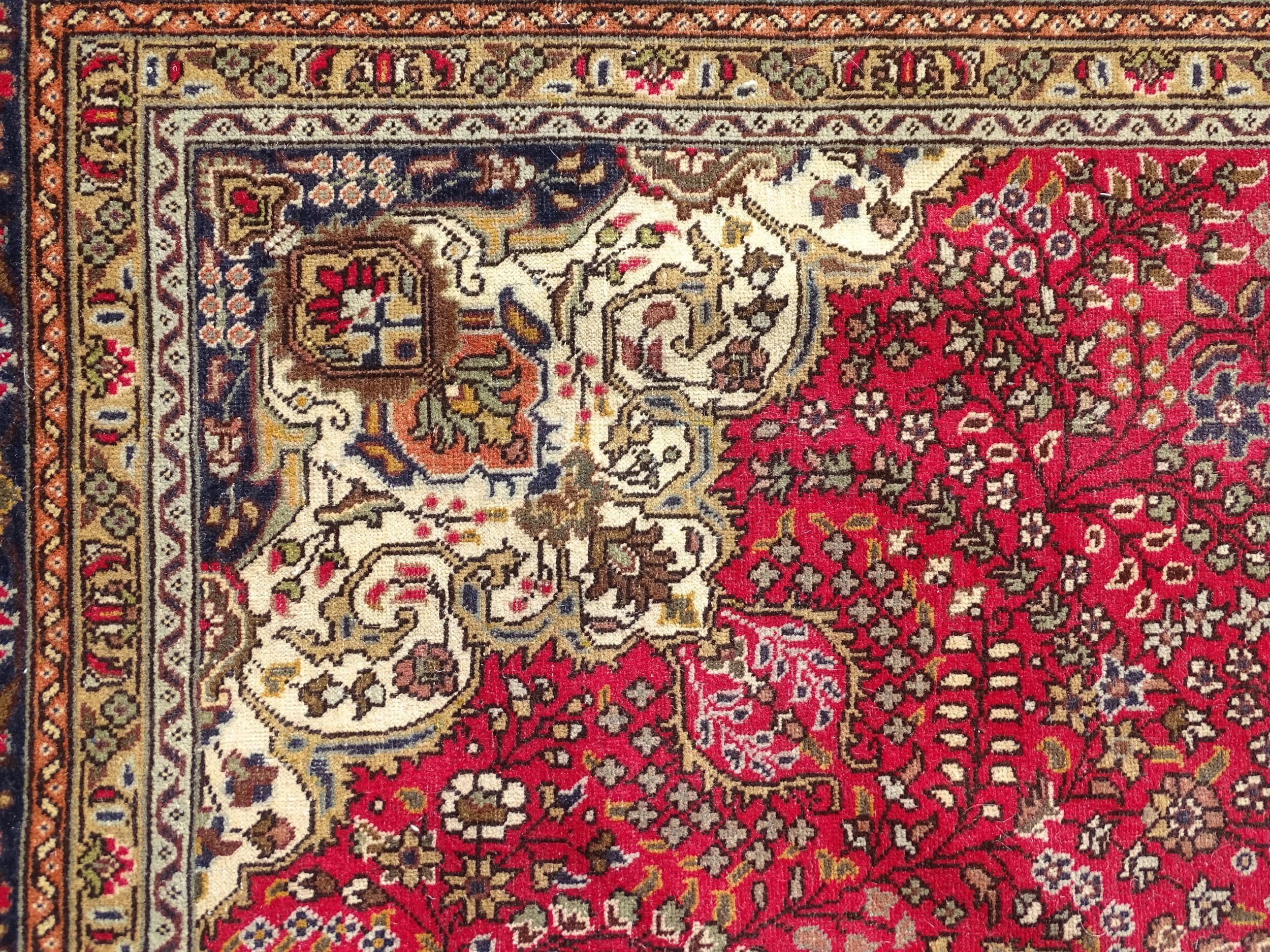 Carpet / Rug : A North West Persian Tabriz carpet, the red ground with central medallion of floral - Image 4 of 6