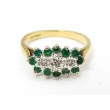 A 9ct gold ring set with emeralds and diamonds. Ring size approx K 1/2 Please Note - we do not