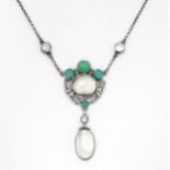 An Arts & Crafts white metal necklace set with moonstone, pearl and green stones. Approx 16" long.