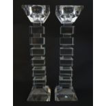 A pair of glass candlesticks with geometric squared detail. Approx 8 1/2" high (2) Please Note -