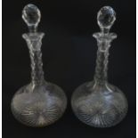 Two 19thC cut glass decanters with star cut decoration. Approx 11"H overall. Please Note - we do not