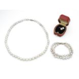 Pearl jewellery comprising a two strand bracelet with silver clasp, a necklace with silver clasp and