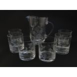 A glass water jug and 6 glasses with engraved floral detail. The Jug approx 7 1/4" high Please