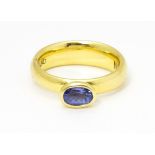 An 18ct gold ring set with oval tanzanite, maker Links of London. Ring size approx M Please Note -