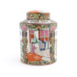A Chinese / Cantonese lidded jar with panelled decoration depicting an interior scene with