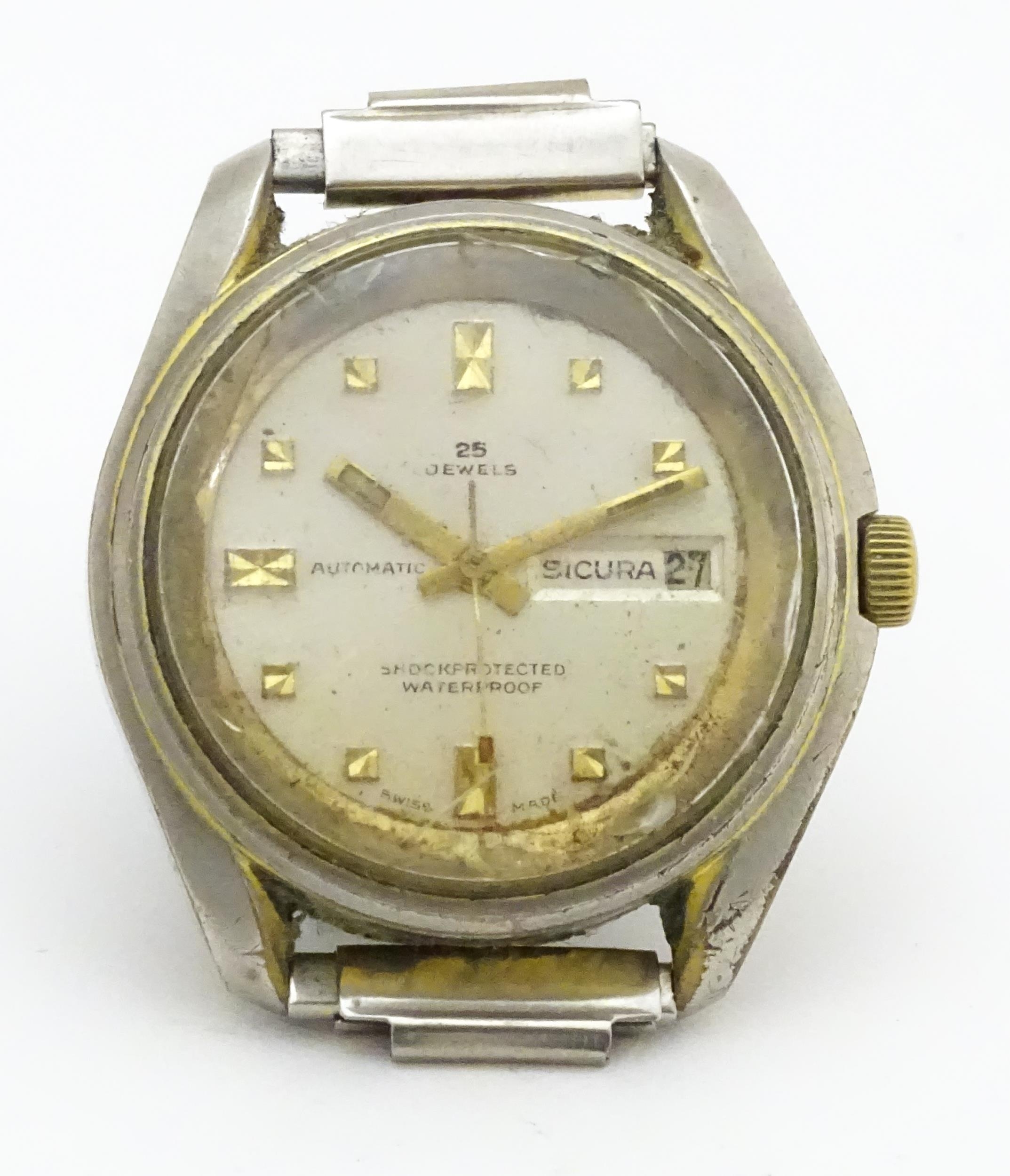 A Sicura Automatic 25 Jewels watch. 1 1/2" wide Please Note - we do not make reference to the