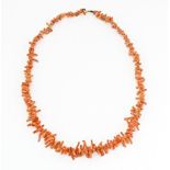 A vintage coral necklace of graduated coral branch beads. Approx. 18" long Please Note - we do not