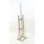 A 20thC chrome plated artist's floor standing adjustable easel. Approx 70" tall Please Note - we