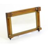 A late 19thC rosewood mirror with applied pillar decoration with gilt highlights and turned