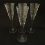 A set of four champagne flutes Approx 10 1/2" high (4) Please Note - we do not make reference to the