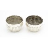 A pair of Victorian silver salts with fluted decoration hallmarked Chester 1900, maker Stokes &
