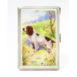 An Art Deco silver cigarette case with enamel Spaniel dog decoration, engine turned detail and