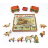 Toys: An early 20thC Chad Valley pull along farmer and animals with troughs. Together with ABC of