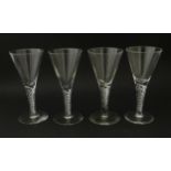 Four late 20thC drinking gasses with air twist detail to stems . Tallest approx. 5 3/4" high (4)