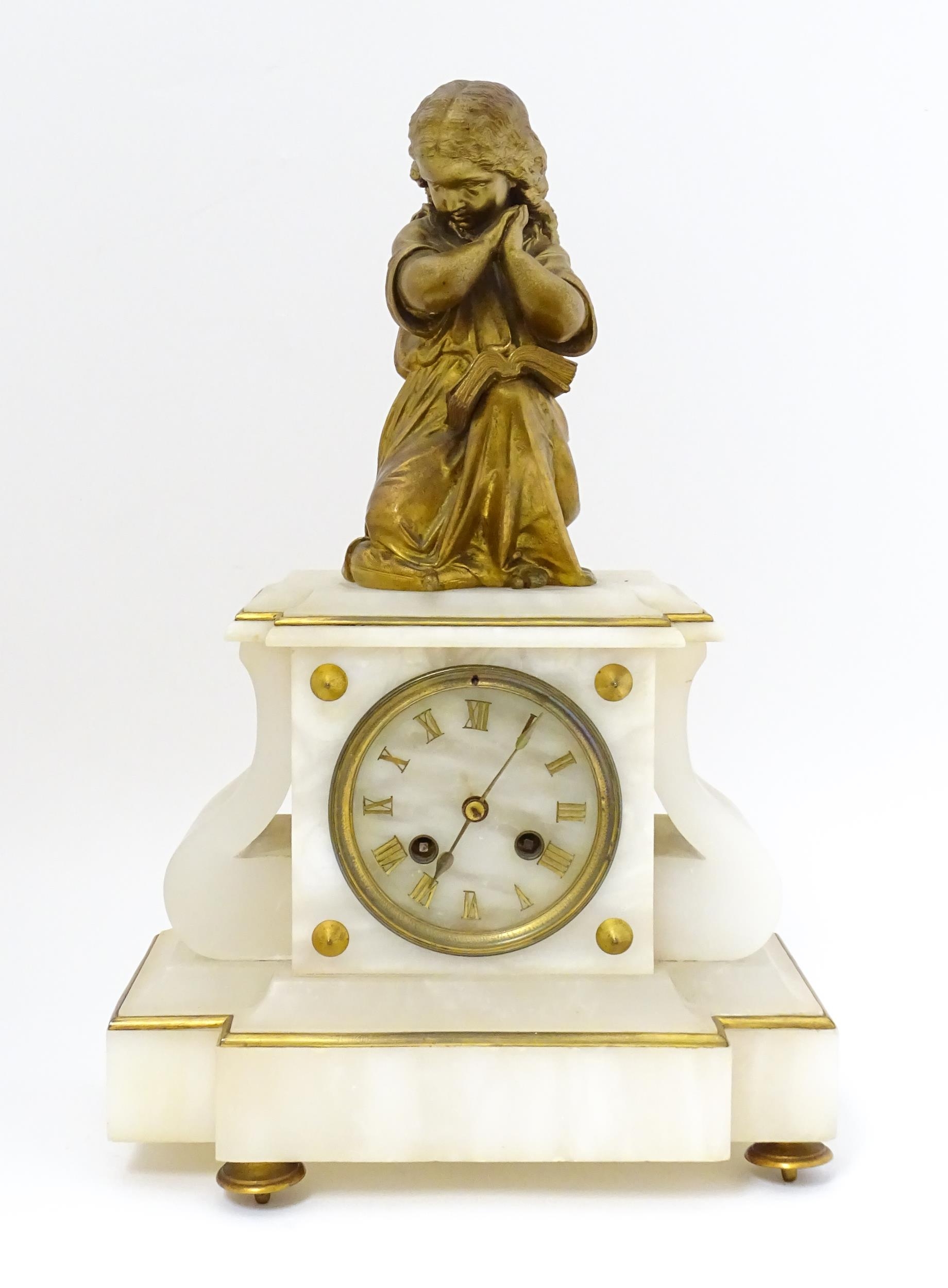 A French Japy Freres mantle clock, the alabaster base with gilt Roman Numerals, surmounted by a cast