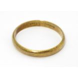 A 14ct gold wedding band marked 585 RDJ and maker Scheel . Ring size approx. W. Please Note - we