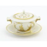 A French Theo Haviland consomme pot with saucer, decorated with gilt chinoiserie detail. Marked