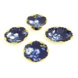 A Haviland Limoges part dessert service with a blue ground and gilt highlights, decorated with