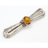 A Continental .835 silver brooch set with central citrine. Indistinctly marked. 2 1/2" wide Please