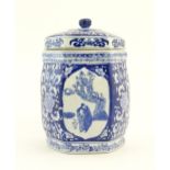 A Chinese blue and white lidded jar and cover of hexagonal form with panelled decoration depicting